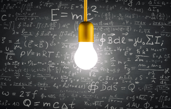 bright light bulb hanging in front of chalkboard with mathmatical equations