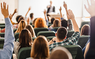 lecture audience raising hands