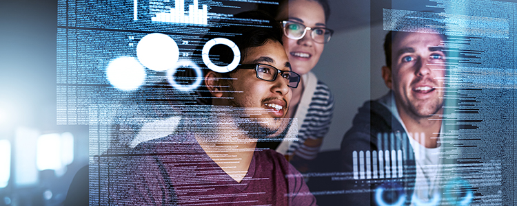 People looking at a transparent screen with data