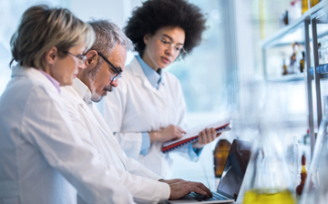 three researchers in a lab