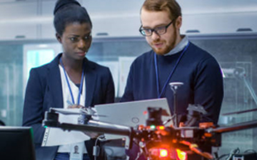 man and woman in laser lab