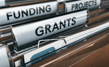 file folders labelled funding, grants and projects