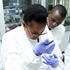 researchers in white coats