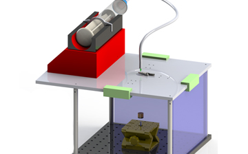 Computer generated diagram of the device. A small red box on top with a wire going down to a larger clear box.