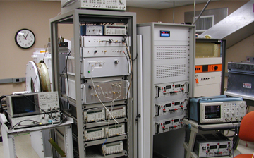 A photo of computers, devices, and electrical equipment in a lab