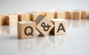 three wooden block with capitalized letter Q, ampersand symbol, and A  