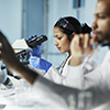 Two scientists from underrepresented populations working in a lab