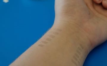 graphene bioimpedance tattoos, applied on the underside of the wrist