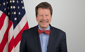 portrait of Dr. Califf with US flag in background