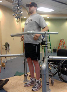 Paralyzed patient is testing spinal stimulation technique and standing on platform. Photo Credit: Dr. Jason Burdick, University of Pennsylvania Paralyzed patient is testing spinal stimulation technique and standing on platform. Photo Credit: Dr. Jason Burdick, University of Pennsylvania