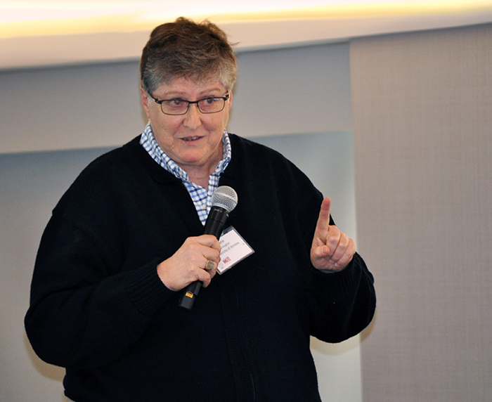 Jane Carrington, University of Arizona, responds to questions from business advisors during her patient-record dashboard pitch.