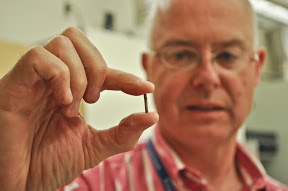 Dr. Weir holding implantable sensor
