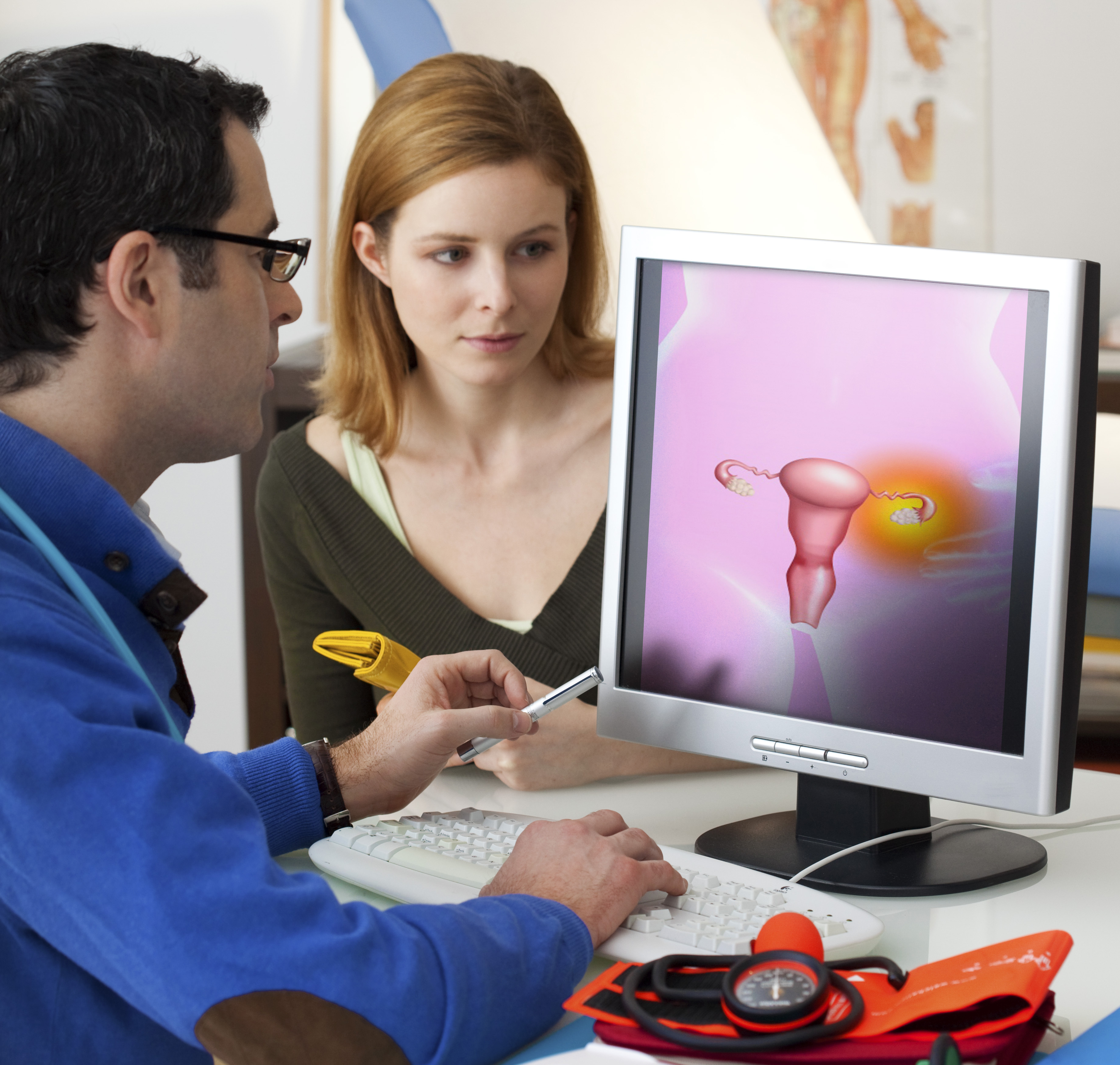 A woman sitting with her doctor