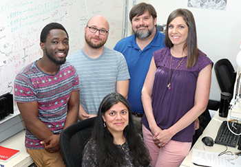 George Patterson in lab with co-workers