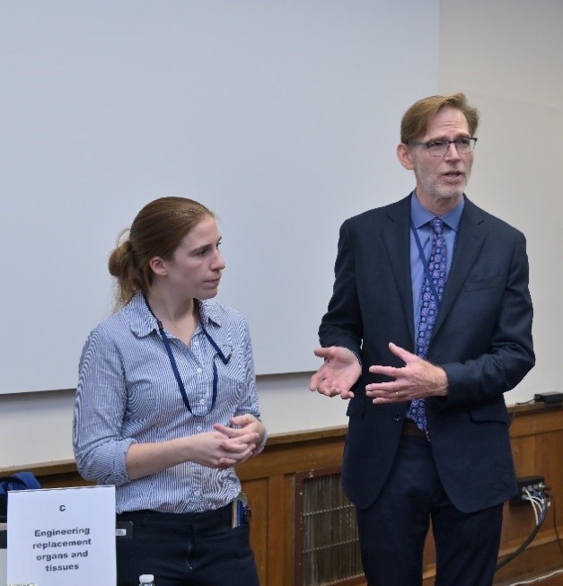 Kaitlyn Sadlter and Bruce Tromberg stand together at a Demo