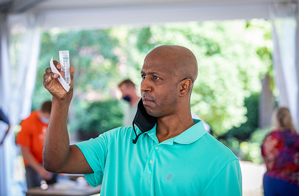 man holding test sample