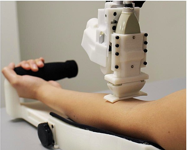robot draws blood from patient arm