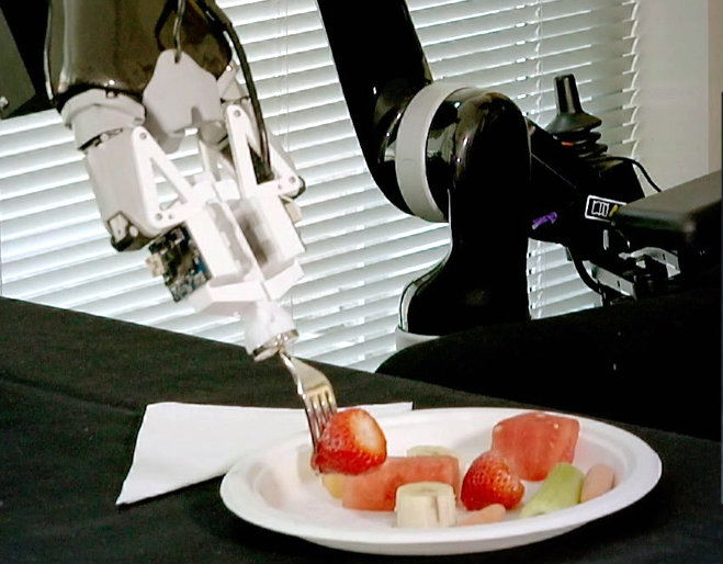 ADA robot skewers strawberry with fork