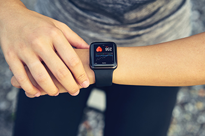 person checking smart device worn on the wrist