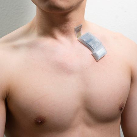 A wireless ultrasound patch is placed on the neck
