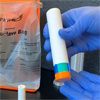 A gloved hand holds the EpicPen epinephrine autoinjector