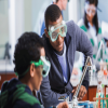 Minority students performing a lab experiment 