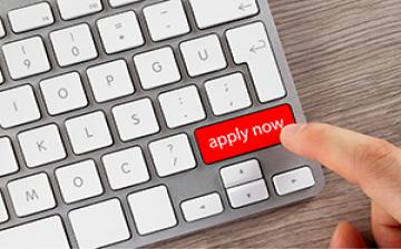 Computer keyboard with a key called apply now
