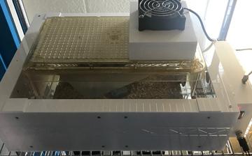 A photo of a white box with a black fan on top.