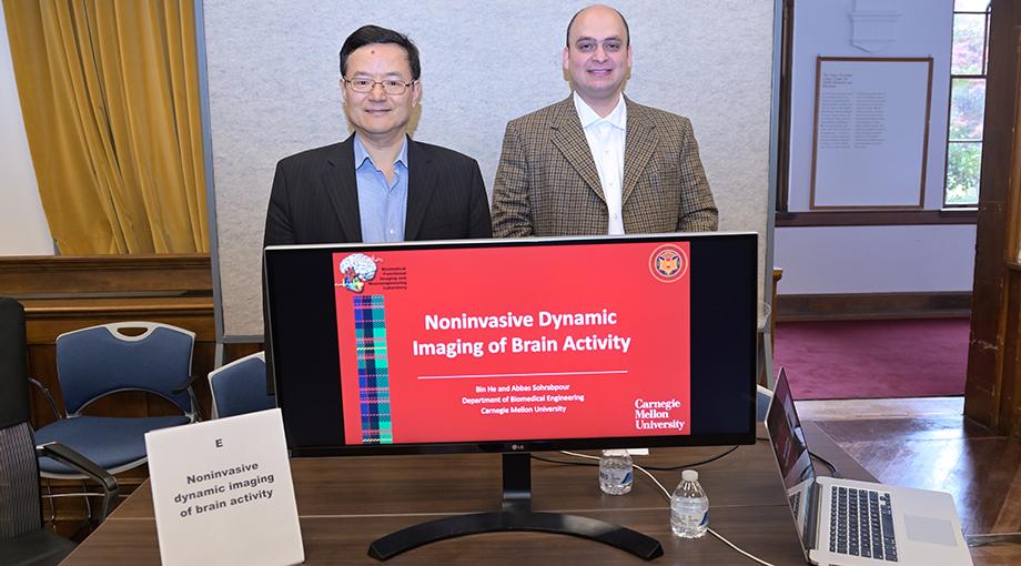 Bin He and Abbas Sohrabpour of Carnegie Mellon University demonstrated a brain mapping technique to congressional staff visiting NIBIB. Using a modified imaging technique that collects data from an EEG, this approach could also be used to help people who are paralyzed controlled a robotic arm.