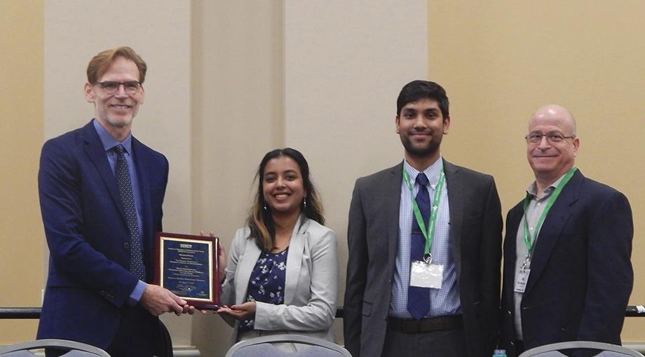 Second-place was awarded to the team from Georgia Tech for developing a rapid, portable C diff test.  Left to Right: Bruce Tromberg, Madhumita Baskaran, Pranav Dorbala, Phil Weilerstein