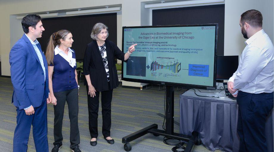 A research group from the University of Chicago discusses how artificial intelligence methods can assist in the analysis of medical images. L-R: Joseph Cozzi, Karen Drukker, Maryellen Giger, Jordan Fuhrman