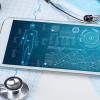 array of items including stethoscope, mobile phone, blood pressure cuff pen