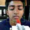 robot feeds strawberry to volunteer