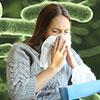 bacteria background with a woman blowing her nose into a tissue
