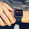 person checking smart device worn on wrist