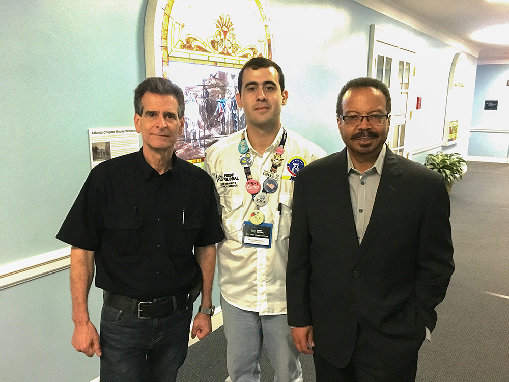 From left, FIRST Global founder Dean Kamen, Venebot team leader Kenny Urdaneta, and NIBIB Director Roderic I. Pettigrew. Photo by NIBIB.